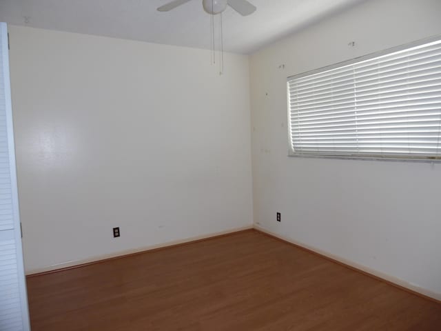 spare room featuring ceiling fan and wood-type flooring