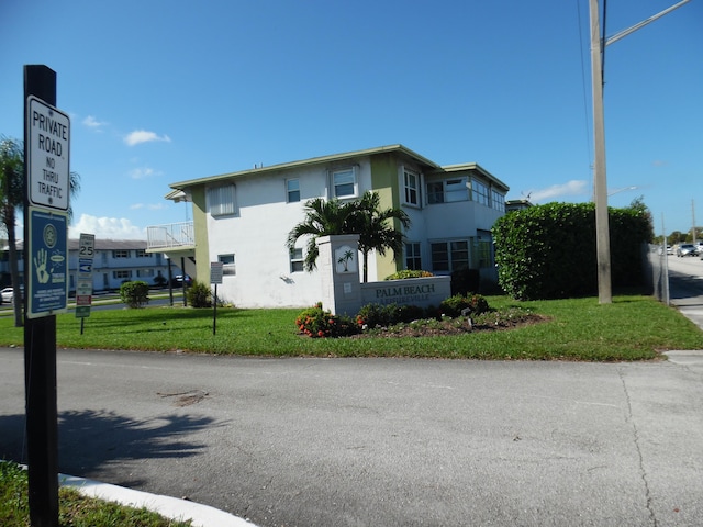 exterior space featuring a front lawn