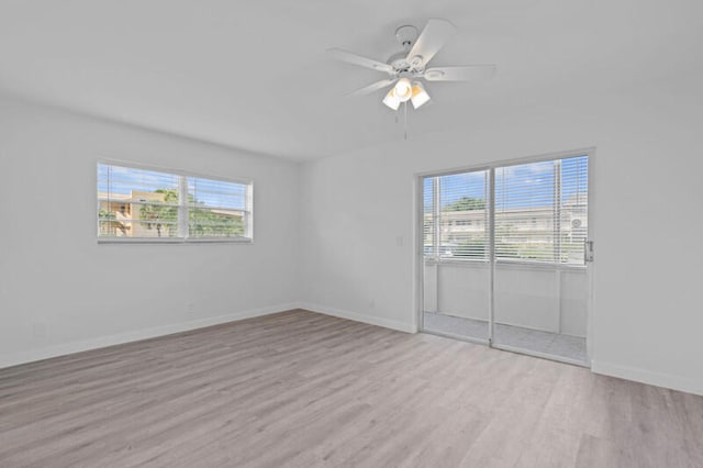 empty room featuring light hardwood / wood-style flooring and ceiling fan