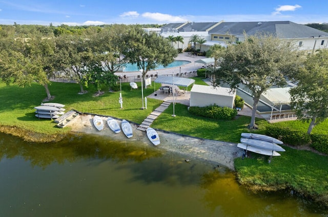 birds eye view of property with a water view