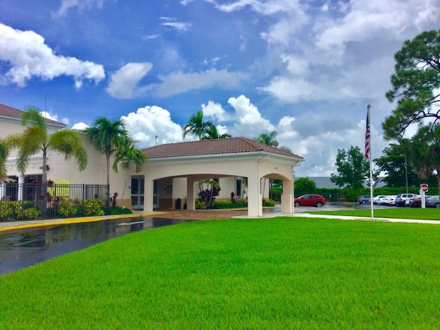 exterior space with a front lawn and a gazebo