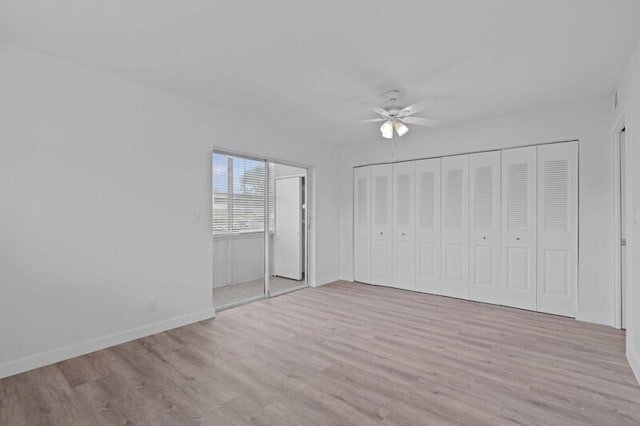 unfurnished bedroom featuring ceiling fan and hardwood / wood-style floors