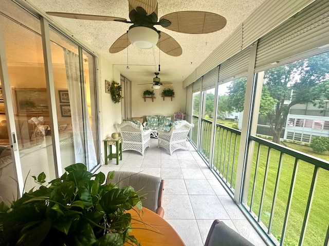 sunroom / solarium with ceiling fan