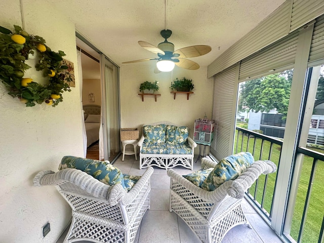 sunroom / solarium with ceiling fan