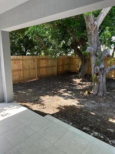 view of yard featuring a fenced backyard and a patio