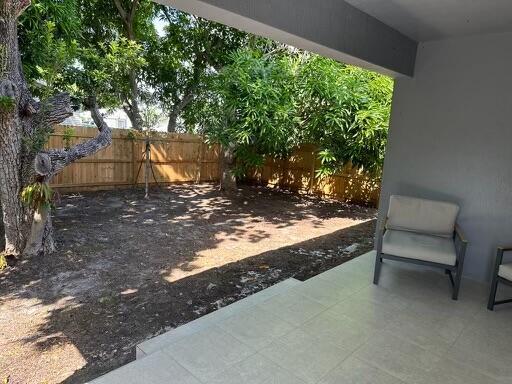 view of yard with a fenced backyard and a patio