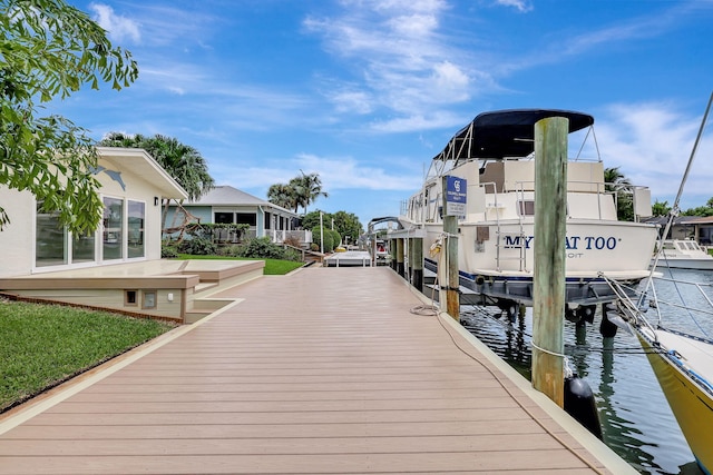 view of dock with a water view and boat lift