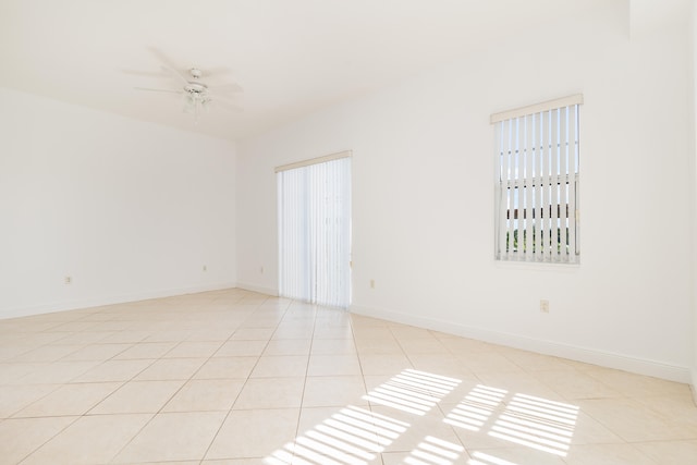 unfurnished room featuring light tile flooring and ceiling fan