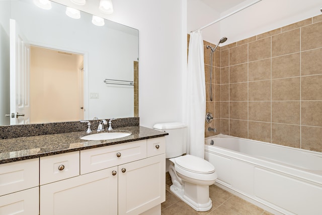 full bathroom featuring toilet, vanity with extensive cabinet space, shower / tub combo with curtain, and tile flooring