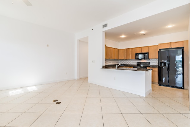 kitchen featuring tasteful backsplash, ceiling fan, light tile floors, and black appliances