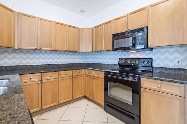 kitchen with tasteful backsplash, dark stone countertops, light tile floors, and black appliances