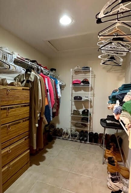 walk in closet featuring light tile patterned floors