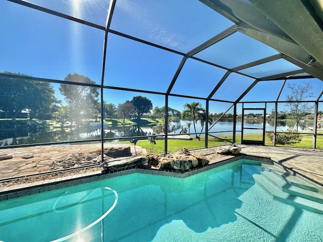 view of swimming pool featuring a water view and a lanai