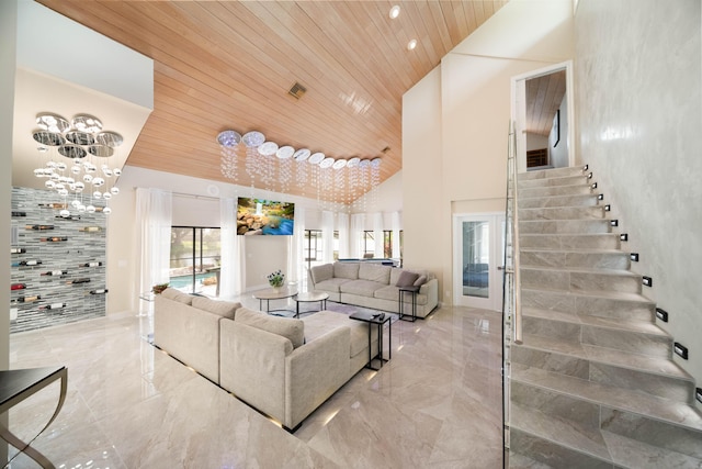 living room with high vaulted ceiling, a notable chandelier, and wooden ceiling