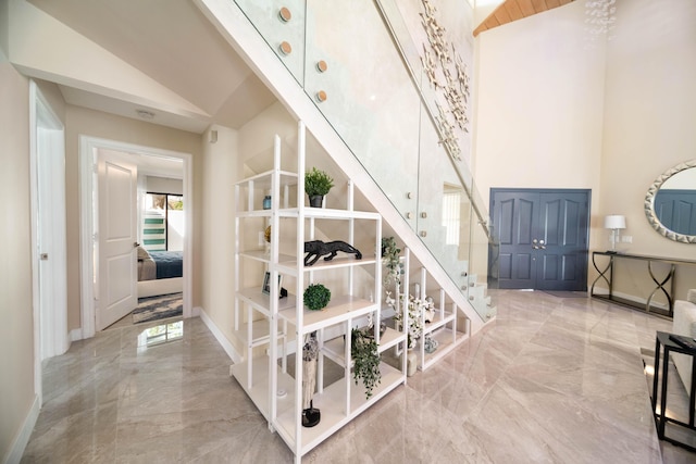 stairs featuring vaulted ceiling