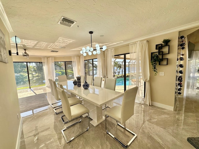 dining space featuring a chandelier, crown molding, and a textured ceiling