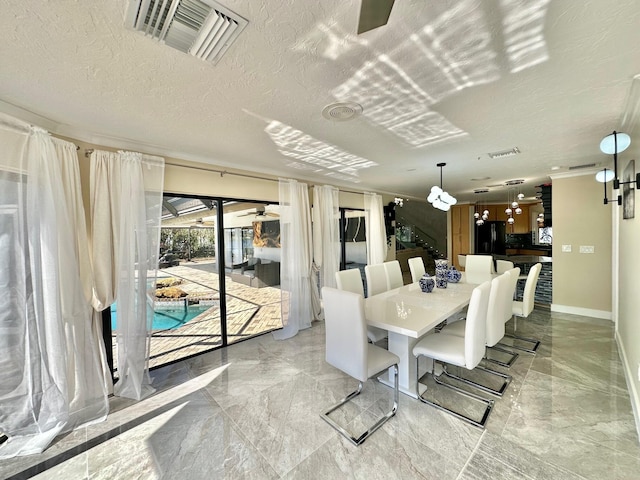 dining room with a textured ceiling