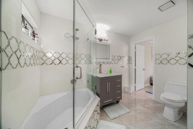 full bathroom featuring bath / shower combo with glass door, toilet, and vanity