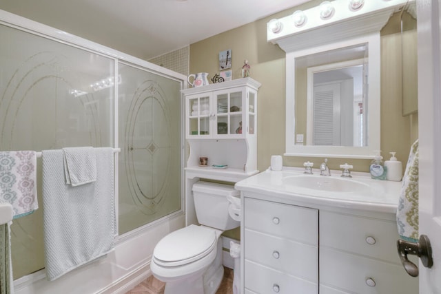 full bathroom with shower / bath combination with glass door, toilet, and vanity