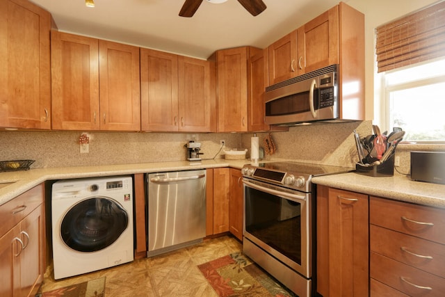 kitchen with stainless steel appliances, washer / dryer, ceiling fan, and backsplash