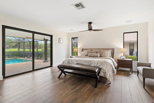 bedroom with access to outside, dark hardwood / wood-style floors, and ceiling fan