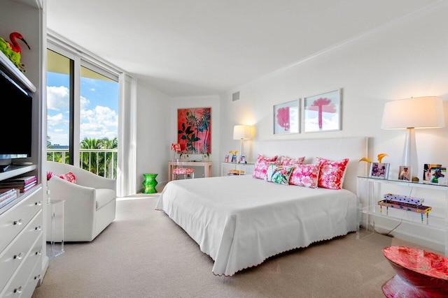 carpeted bedroom featuring access to outside