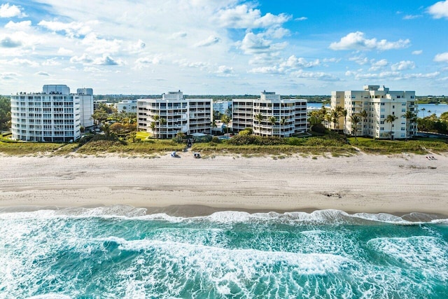 aerial view featuring a view of the beach and a water view