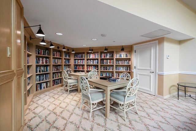 dining space featuring light colored carpet