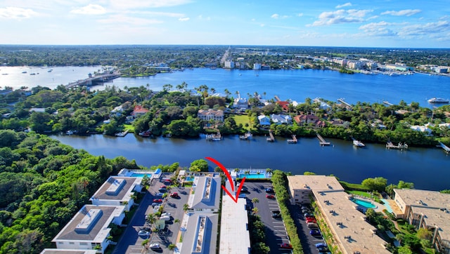 birds eye view of property with a water view