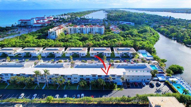 birds eye view of property featuring a water view