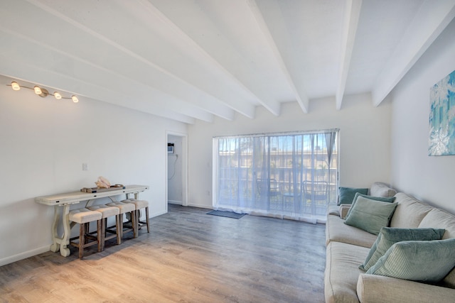 living room featuring light wood-type flooring and beam ceiling