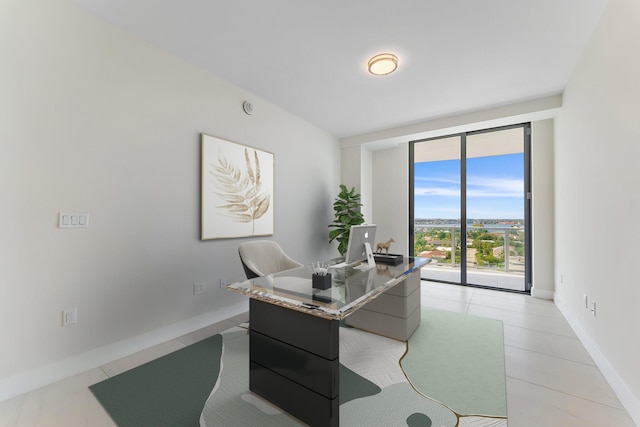 office space with light tile patterned floors and baseboards