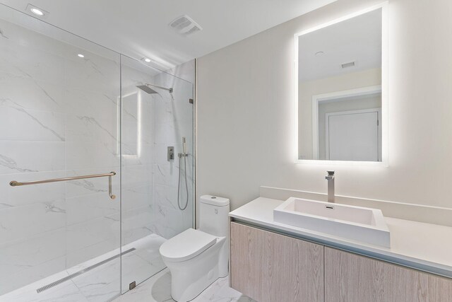 bathroom with walk in shower, toilet, and vanity