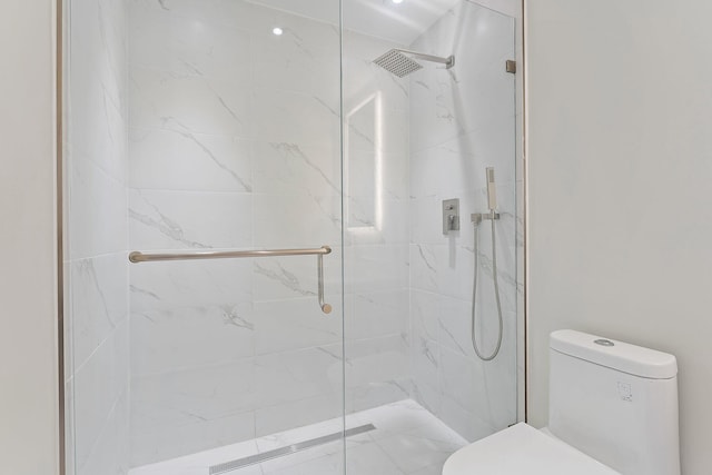 full bathroom featuring a marble finish shower and toilet