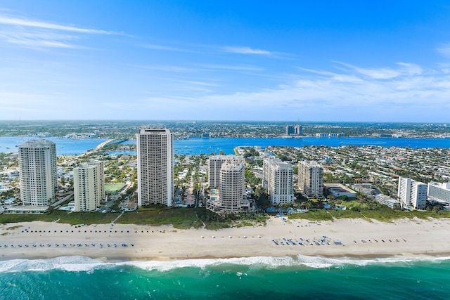 bird's eye view with a view of city, a water view, and a beach view