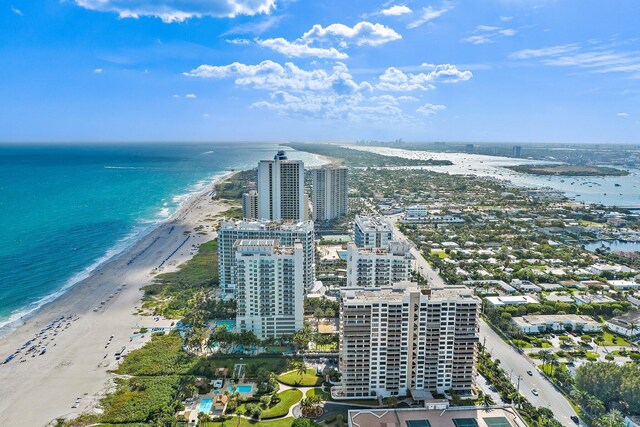 bird's eye view featuring a water view and a beach view