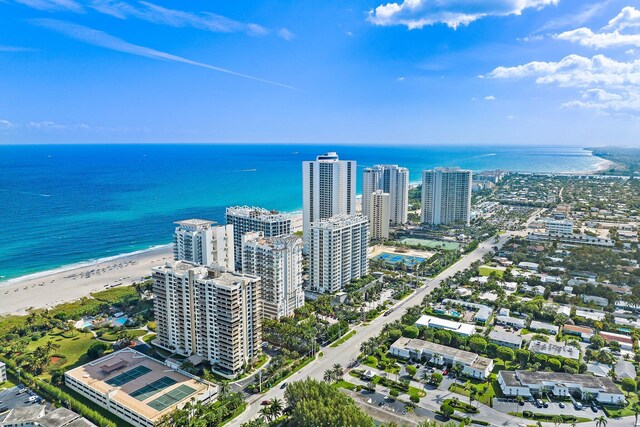 aerial view featuring a view of the beach and a water view