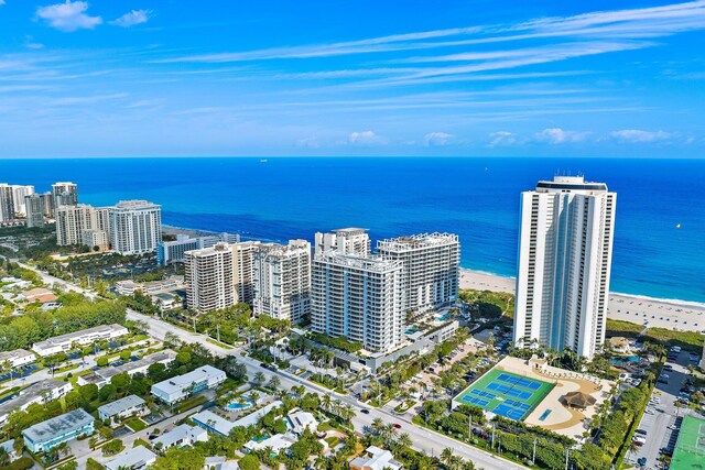 bird's eye view featuring a water view and a view of the beach