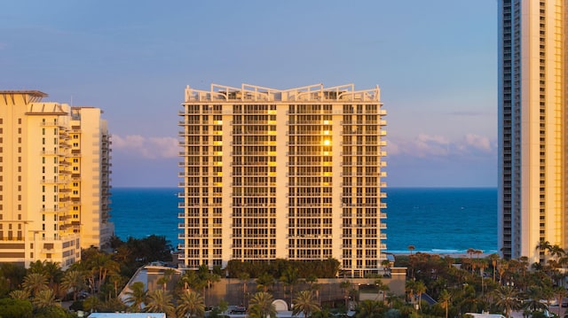 outdoor building at dusk featuring a water view