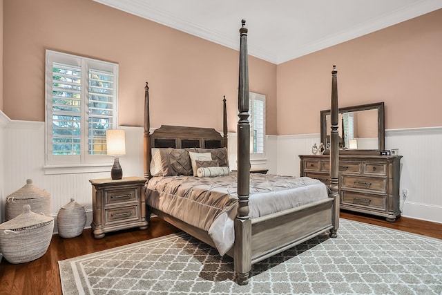 bedroom featuring dark hardwood / wood-style floors and crown molding