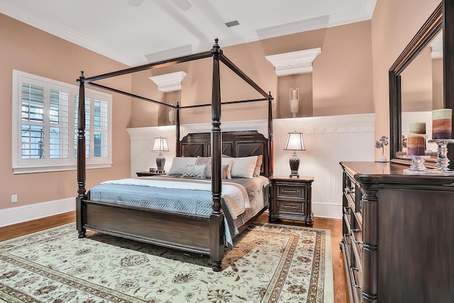 bedroom featuring crown molding, ceiling fan, and hardwood / wood-style flooring