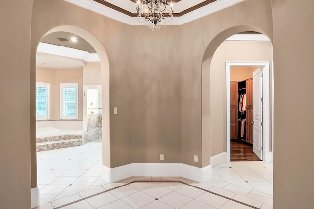 unfurnished room featuring light tile patterned flooring, crown molding, and an inviting chandelier