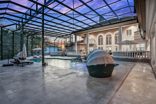 exterior space featuring french doors, pool water feature, a patio area, and a lanai