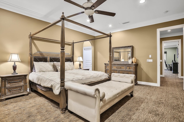 carpeted bedroom featuring ceiling fan and ornamental molding