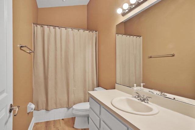 full bathroom with shower / tub combo with curtain, vanity, wood-type flooring, and toilet