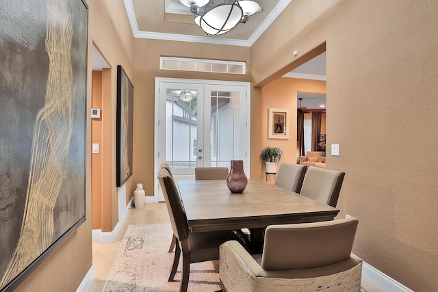 dining space with crown molding, french doors, light tile patterned floors, and a notable chandelier