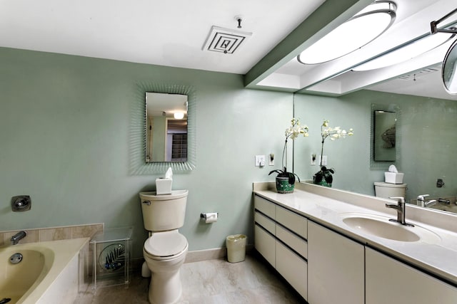 bathroom with toilet, a tub to relax in, and vanity