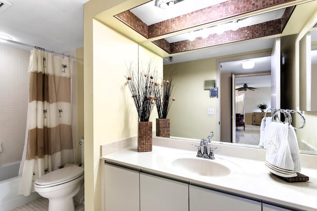 full bathroom featuring toilet, tile patterned flooring, shower / bath combination with curtain, ceiling fan, and vanity