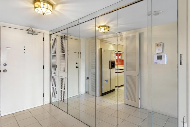 entryway featuring light tile patterned floors