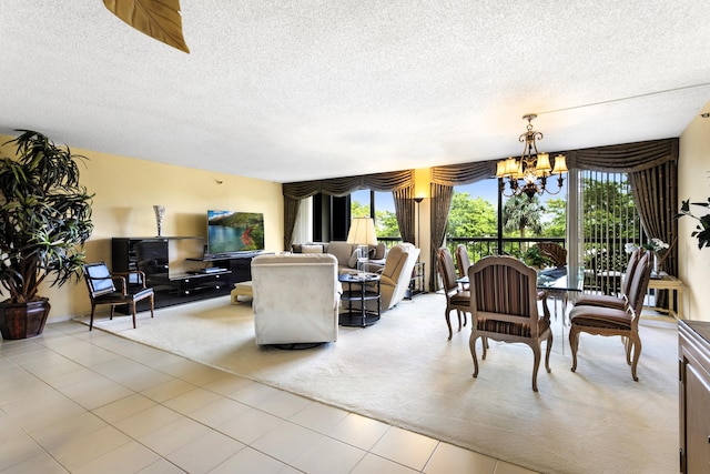 living room featuring a textured ceiling, a chandelier, plenty of natural light, and light tile patterned floors